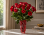 18 Red Roses in a red swirl vase