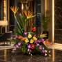 Tropical themed arrangement on black marble table.