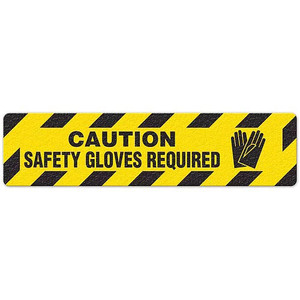 Photograph of an anti-slip floor safety sign reading "Caution Safety Gloves Required" in black on a yellow background.  Includes a graphic of black gloves.