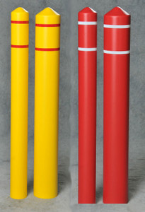 A photograph of four 02285 eagle smooth bollard post sleeves with reflective striping in both red and yellow, and differing diameters.