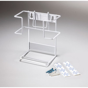 A photograph of an empty metal 06005 lens cleaner towelette dispensers.