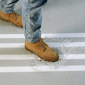 A photograph of 06469 waterproof anti-skid tape in use on floor of a facility.