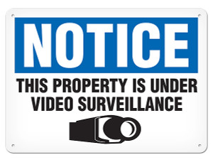 A photograph of a 01660 notice this property is under video surveillance OSHA sign with video camera icon.