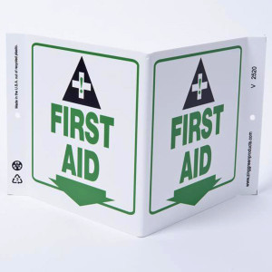 A photograph of a 00264 first aid wall-projecting v-sign w/ icon and down arrow.