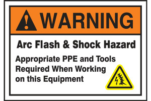 A photograph of an orange and white 07337 ANSI warning arc flash label with arc flash icon.