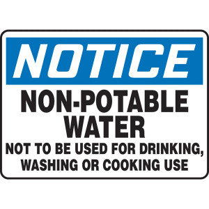 A photograph of An OSHA Non-Potable Water Sign.  The word "NOTICE" is in white letters on a blue background at the top of the sign.  "Non-Potable Water, Not to be Used for Drinking, Washing or Cooking Use" printed in black letters on a white background below.