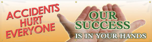 Picture of Workplace Safety Banner that features a warm orange background, the image of a worker cupping their hands, and wording "Accidents Hurt Everyone" in soft red text. Cupped in the worker's hands is the wording "Our Success Is In Your Hands" in soothing green and white text.