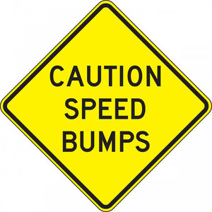 A photograph of a yellow and black 06257 speed bump sign, reading caution speed bumps.