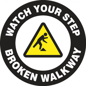 This black and white sign features a yellow caution sign in the center with the image of a figure tripping over an obstacle. White text on a black border reads "Watch Your Step, Broken Walkway". Use for areas with broken and dangerous walkways.