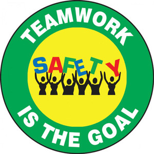 This colorful green and yellow sign features the text" Teamwork Is The Goal". The center features the image of a group of people holding up the word "Safety" in colorful letters. Use for teambuilding and raising morale.
