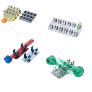 A photograph of several types of Clip-Plates:  Universal Clips Plate, Hybridization Tube Clip Plate,  Multi-Tube Clip Plate, 100 ml Volumetric Flask Cli plate.