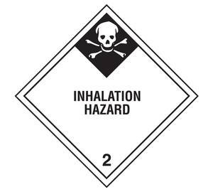 A photograph of a 03028 class 2 inhalation hazard dot shipping labels, with 500 per roll.