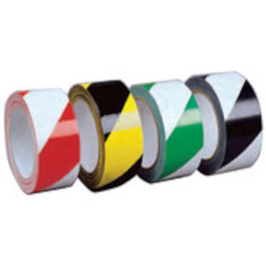 A photograph of a four rolls of striped hazard warning laminated tape. From left to right: red/white, yellow/black, green/white, black/white.