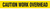 A drawing of an unrolled section of tape showing "CAUTION WORK OVERHEAD" in black on yellow.