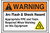 A photograph of an orange and white 07337 ANSI warning arc flash label with arc flash icon.