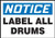 A drawing of a 01575 white label with a blue OSHA NOTICE header and the text LABEL ALL DRUMS in black.