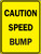 A photograph of a yellow and black 06251 speed bump sign, reading caution speed bump.