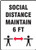 A photograph of a black and white 03443 social distance maintain 6 ft safety sign, with distancing graphic.