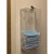 Photograph of the Locking Face Mask Dispenser, mounted on a wall with masks (not included) inside.
