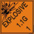 An orange and black photograph of a 03062 dot explosives shipping label, reading explosives 1.1G 1 with graphic.