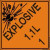 An orange and black photograph of a 03062 dot explosives shipping label, reading explosives 1.1L 1 with graphic.