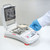 Photograph of a solid sample being loaded in Ohaus MB32 Moisture Analyzer.