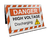 Image of the orange and white high visibility sign features the text: "DANGER HIGH VOLTAGE DISCHARGING", with a yellow electrical discharge symbol, at a 45 degree angle.