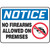 A photograph of An OSHA No Firearms Sign.  The word "NOTICE" is in white letters on a blue background at the top of the sign.  Below the header are the words "No Firearms Allowed on Premises" in black on a white background next to a graphic of a pistol with a red circle with a line through it.