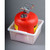 A photograph of a red 5-gallon  Safety Can (not included) in a Justrite Spill Basin.