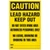 Drawing of a Lead hazard Sign.  The header has the word CAUTION in yellow lettering on a black background.  The remainder of the sign has black lettering on a yellow background and reads: "Caution", Lead Hazard Keep Out, Do Not Enter Work Area, Authorized Personnel Only, No Eating, Drinking or Smoking In This Area."  There are two spaces at the bottom of the sign for Date and Location.