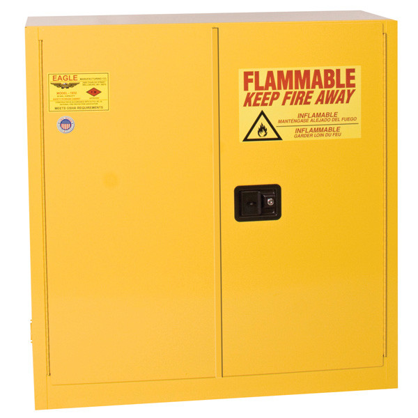 A photograph of a yellow standard 02006 eagle flammable liquid safety cabinets, with 30 gallon capacity and both doors closed.