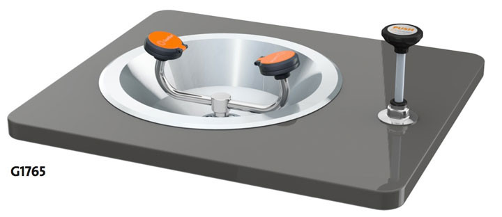 A photograph of a Guardian G1765 Eye/Face Wash, Recess Deck Mounted, Push-Down Valve mounted on a countertop (countertop not included).