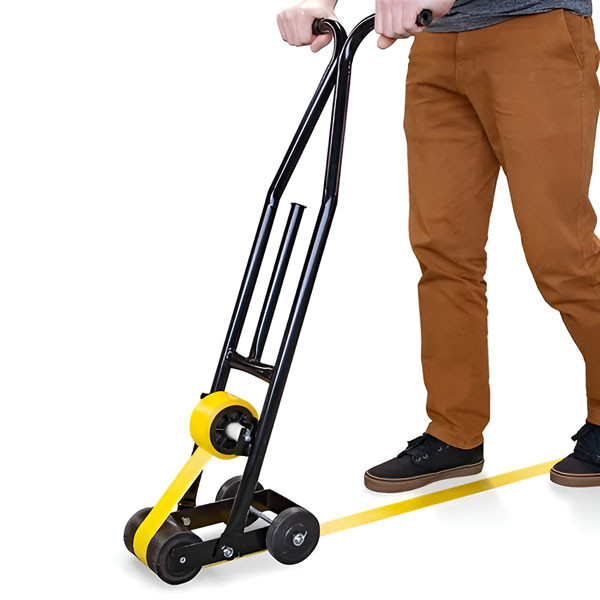A photograph of a WTD200, floor tape applicator in use.