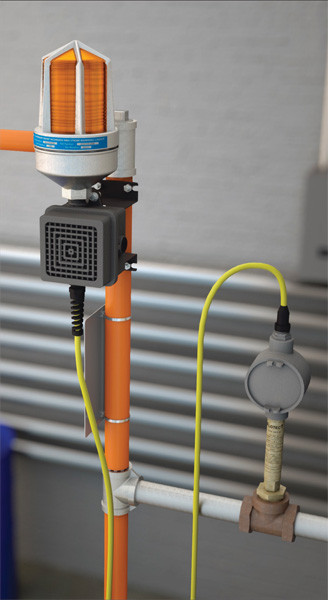 A photograph of an AP275-700N4 Series Electric Alarm Unit w/ Strobe Light and Horn for NEMA 4 Environments installed on a safety shower.