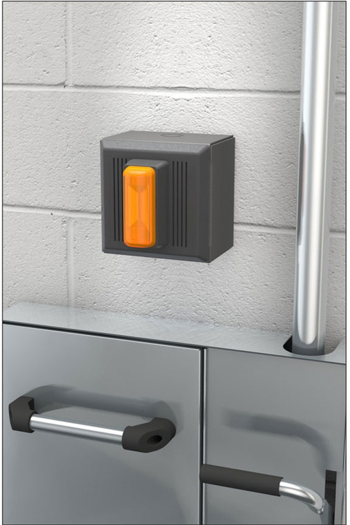 A photograph of an AP280-240 Series Electric Alarm Units for Surface-Mounted Laboratory Units mounted above a recessed safety station.