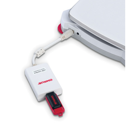 Photograph of USB Host (Female) Interface Cable attached to a balance, with USB drive (not included).