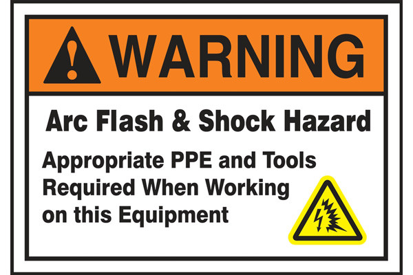 A photograph of an orange and white 07337 ANSI warning arc flash label with arc flash icon.