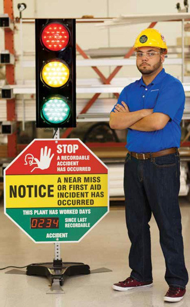 A photograph of a 06395 signal safety awareness center with a person standing next to it.
