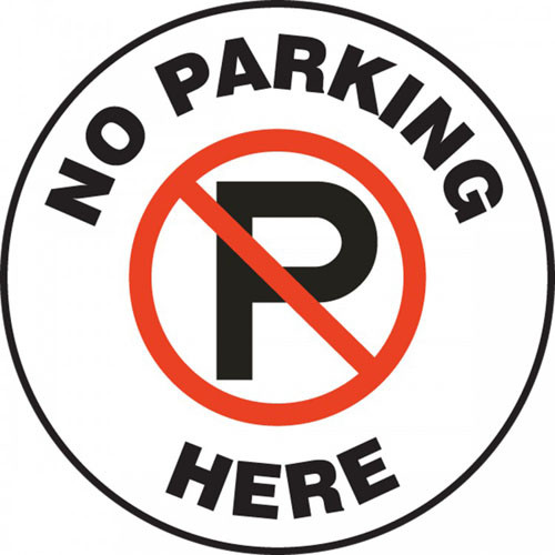 A photograph of a white and black 11255 pavement print sign, reading no parking here, with no parking symbol.