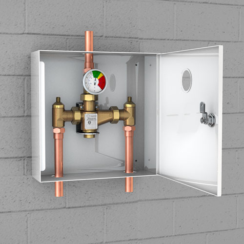 A photo of the G6021 TMV in a surface-mounted cabinet installed on a cinderblock wall.