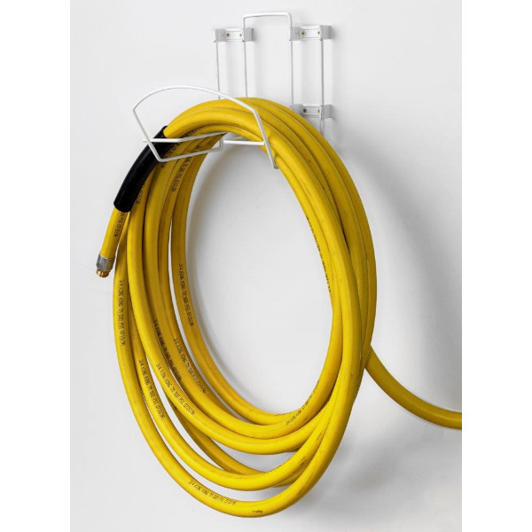 An image of 06088 White PVC Sanitation Hose Rack with a yellow hose hanging on it.