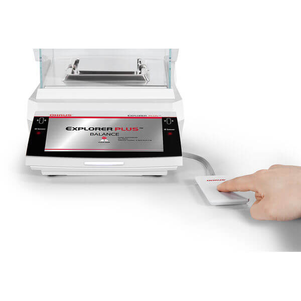 A photograph of a fingerprint scanner,FUN-100A, attached to an Ohaus Explorer-Plus Balance (not included).