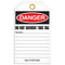 A photograph of back of a 07083 tag, reading danger do not remove this tag.