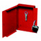 A photograph of inside of a red 09434 metal fire department lock box with padlock and key.
