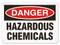 A photograph of a 01565 danger, hazardous chemicals OSHA sign.