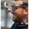 Person wearing the face shield with dental loupes.