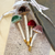 Personalized velvet mushroom ornaments with messages printed on the stems