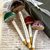 Close-up of printed messages and golden details on velvet mushrooms