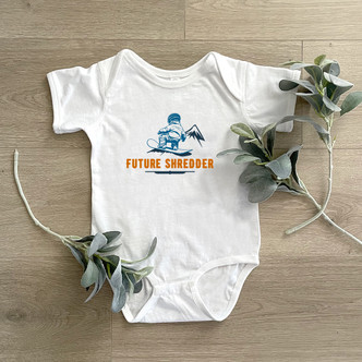 Future Shredder - Baby Child Onesie with baby snowboarder in blues and orange on white, light blue and pink onesies.