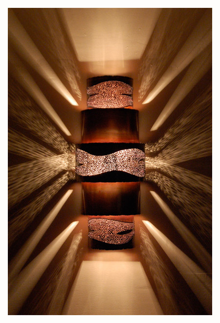 Night View of the Burned Ziggurat Wall Sconce.  Regardless of your selection of solid banding the fixtures will look similar in the dark.  They provide a wonderful pattern on your wall when used with the appropriate clear bulbs as well as up and down lighting.